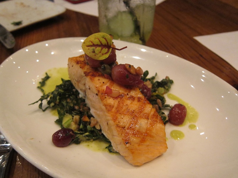 Grilled salmon with kale, bulgar and grape salad